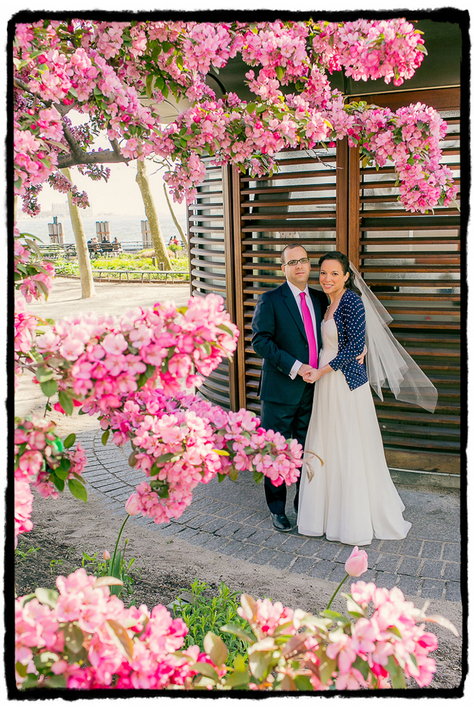 When I saw these gorgeous pink cherry blossoms I knew I had to frame a portrait of the couple, they matched the groom's tie so beautifully.