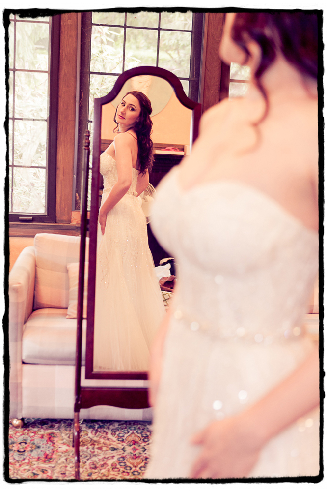 Michelle checks the final fit of her wedding dress in the mirror at Lyndhurst Mansion..