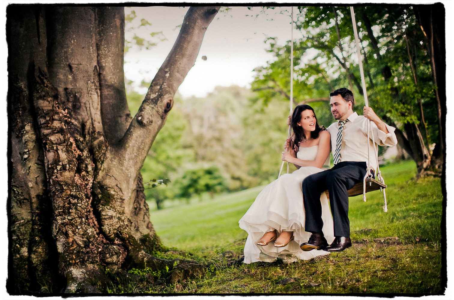 A couple takes time with me for some 'just married' shots of them enjoying the tree swing at Winthrop Estate.