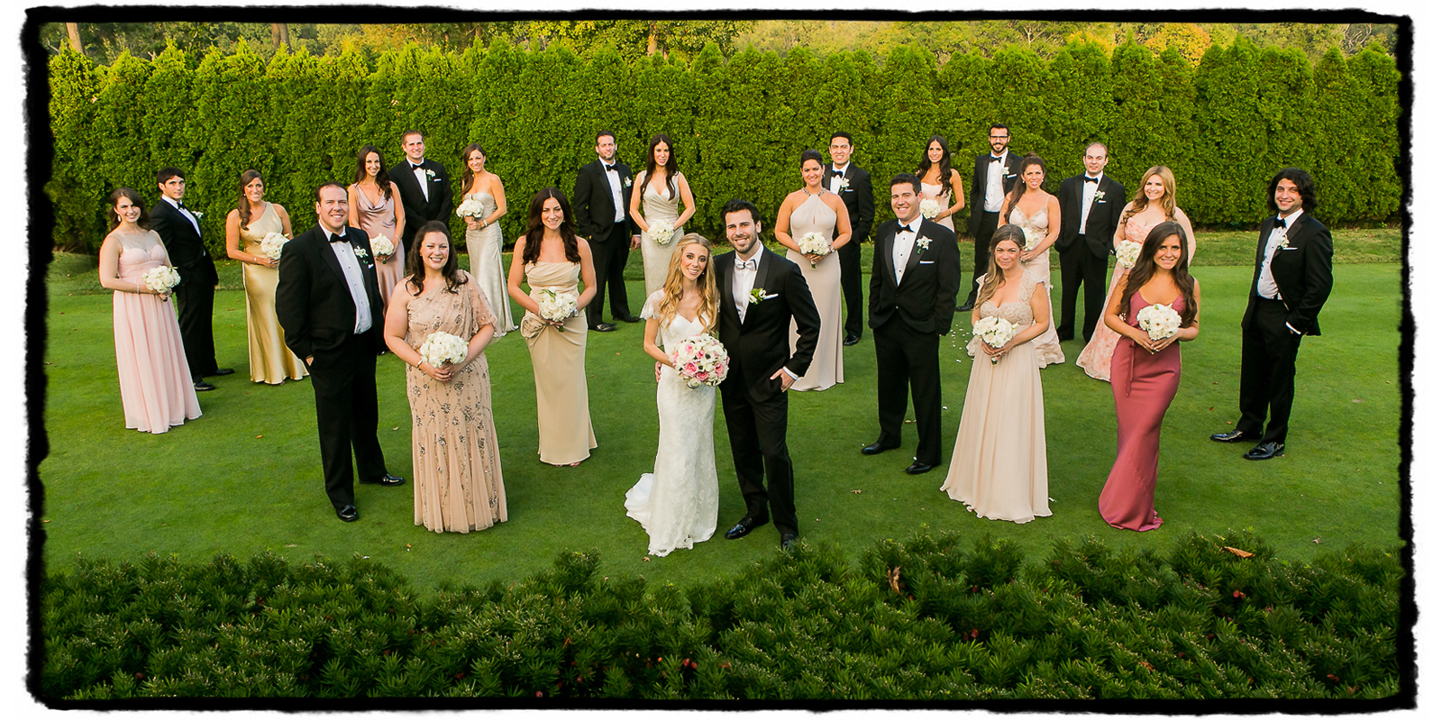Jayme and Brad's black tie bridal party in shades of pink at Fresh Meadow Country Club.