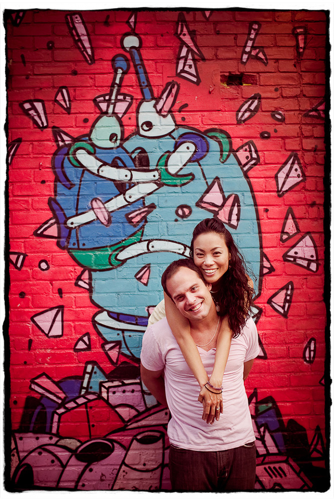 Engagement Portrait: Bajir & Maki pose for me in front of some sweet street art in Williamsburg, Brooklyn.
