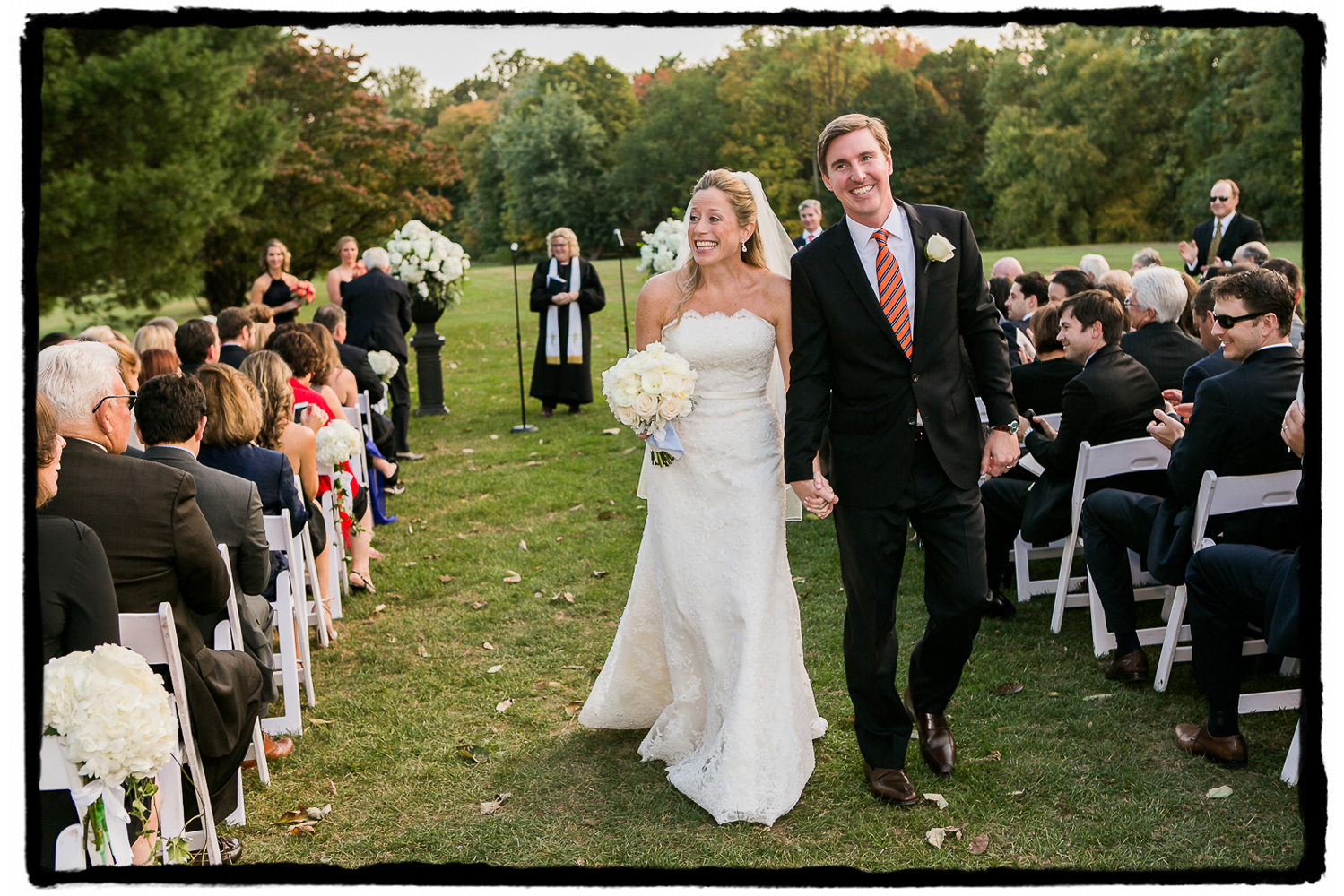 The smiles were contageous at Highlands Country Club as Noelle and Tim walked back down the aisle as husband and wife.