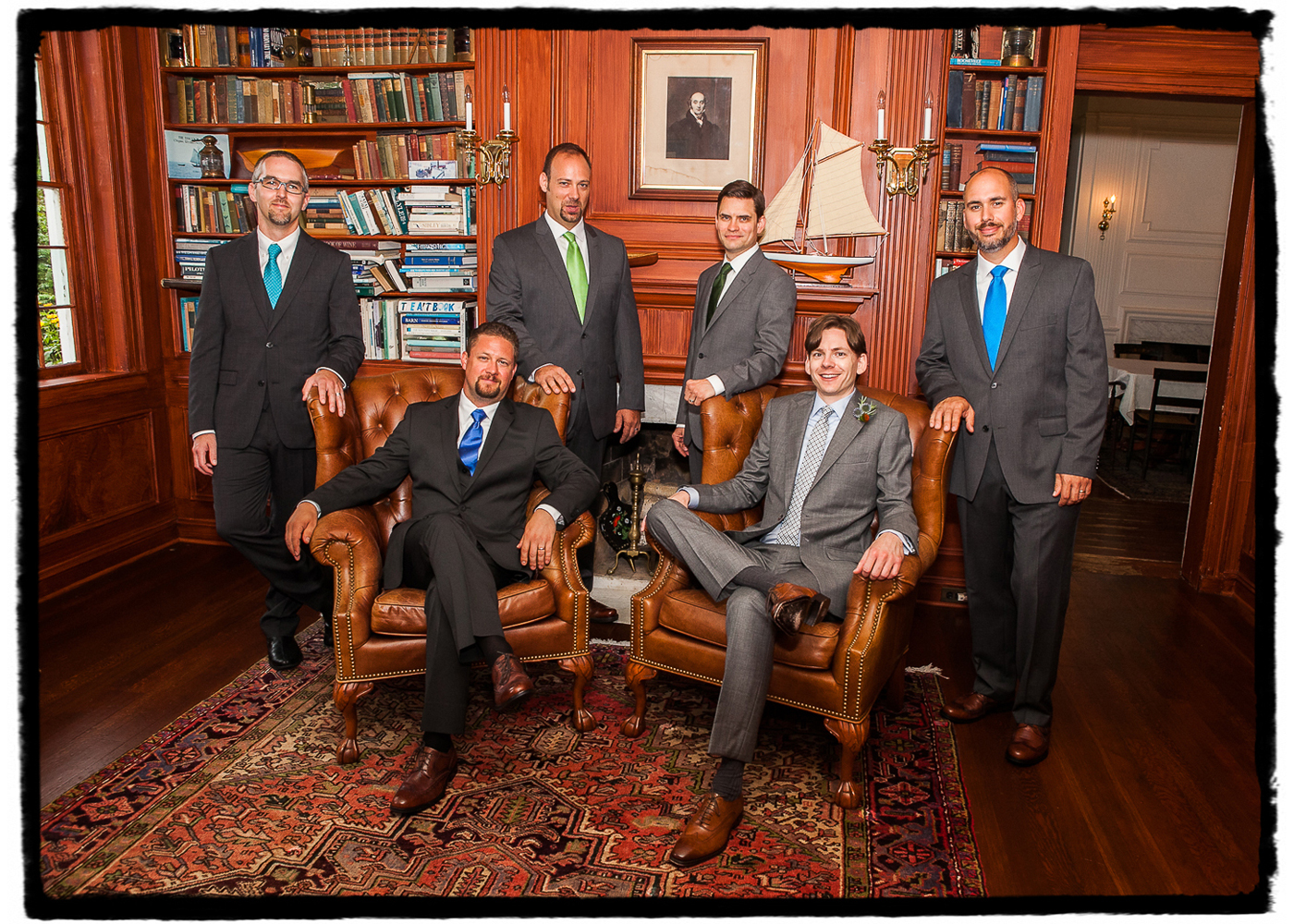 Dano and his groomsmen enjoy the handsome interior at this charming Inn by a lake.