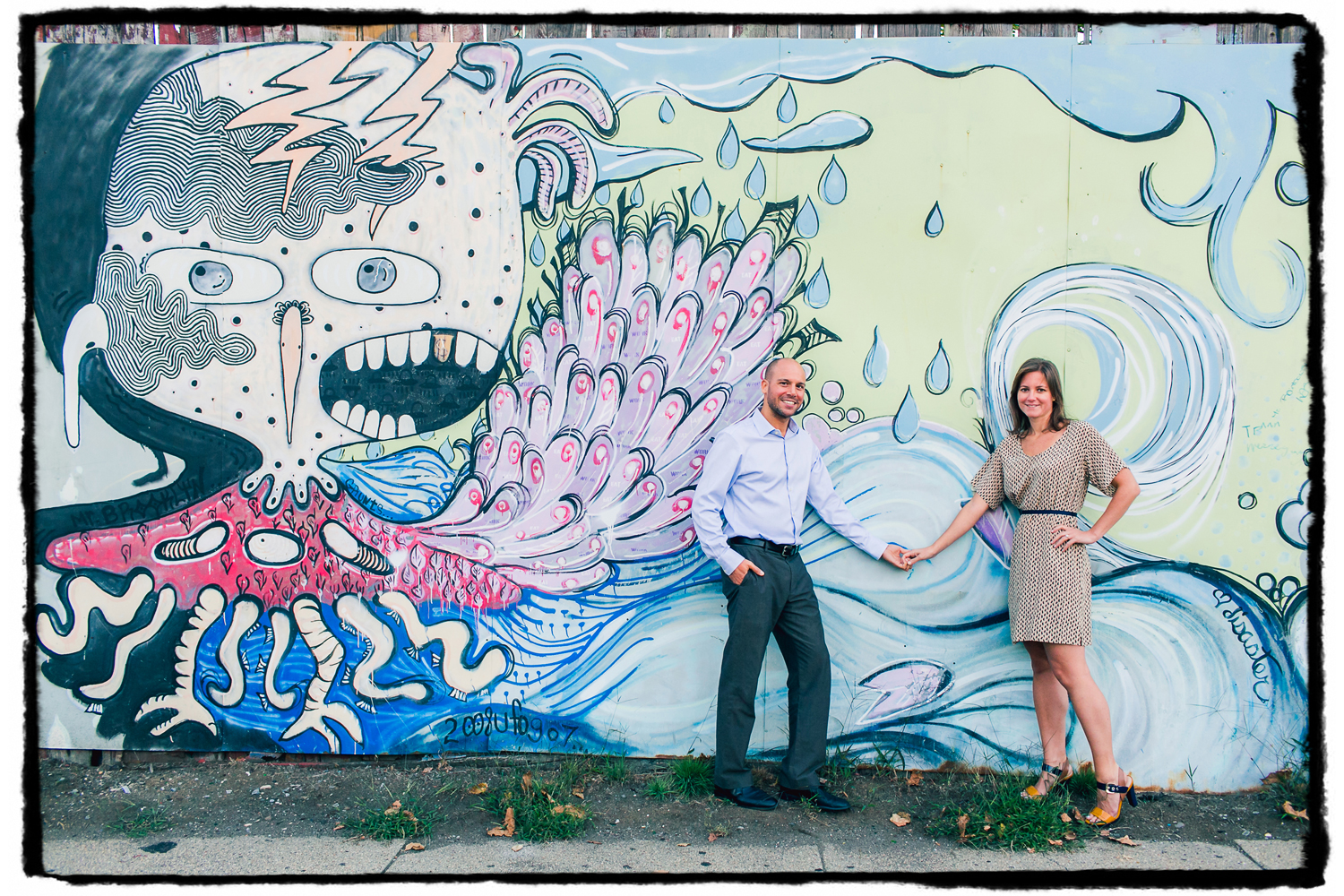 Engagement Portrait: Laura & Joel show off the street art in their neighborhood of Red Hook, Brooklyn.