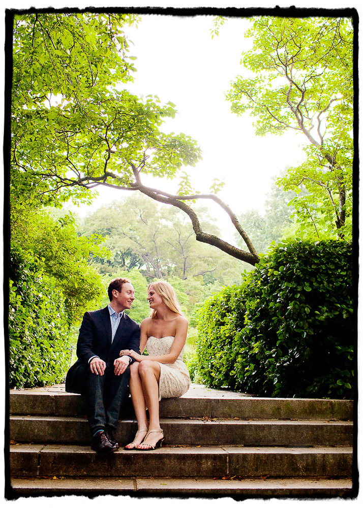 Engagement Portrait: Charlie & Kate sit on the steps in Central Park Conservancy Gardens.