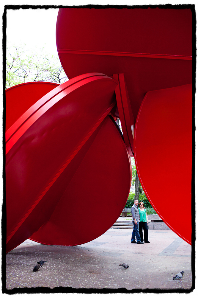 Engagement Portraits: Cheryl & Brian by a sculpture at City Hall.