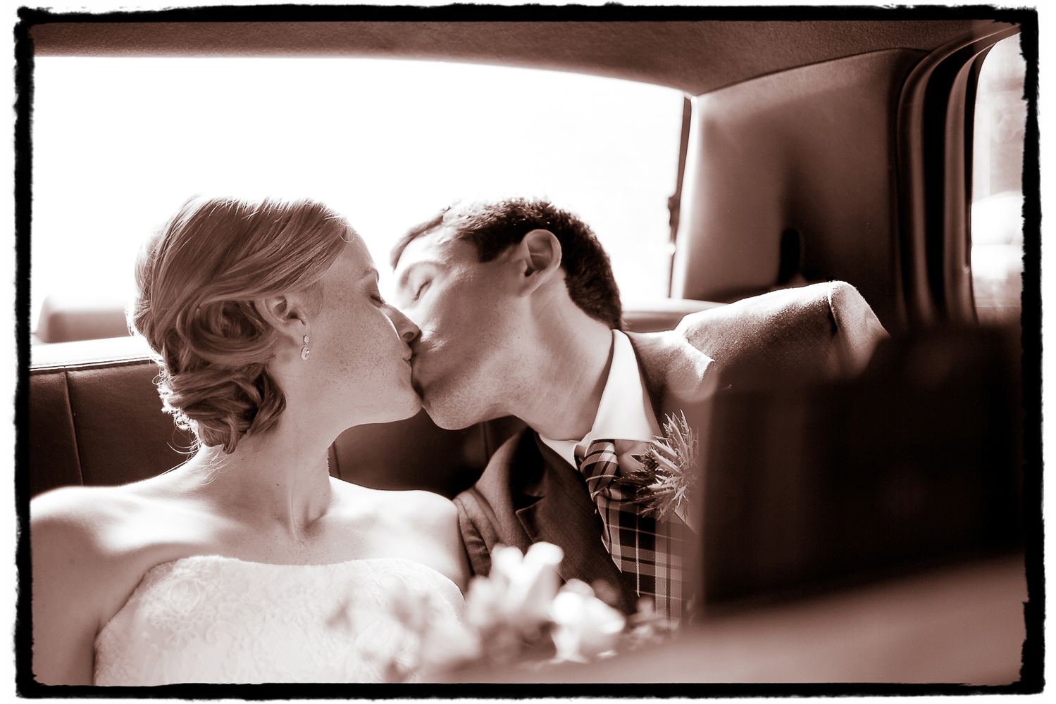 Seth and Jennifer sharing a moment in the back of our cab en route to Housing Works Bookstore in SoHo from the family and bridal party group shots we took by the Arch in Washington Square Park.
