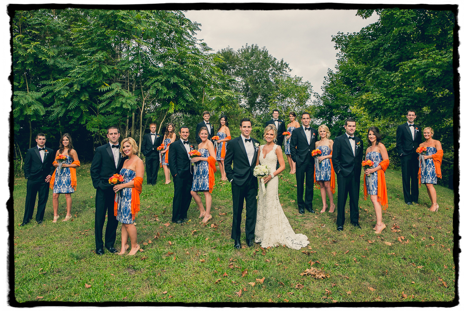 Patterned blue and orange paired with black tuxedos were the order of the day for Devin & Mike's wedding at Belle Haven Club in Greenwich, CT.