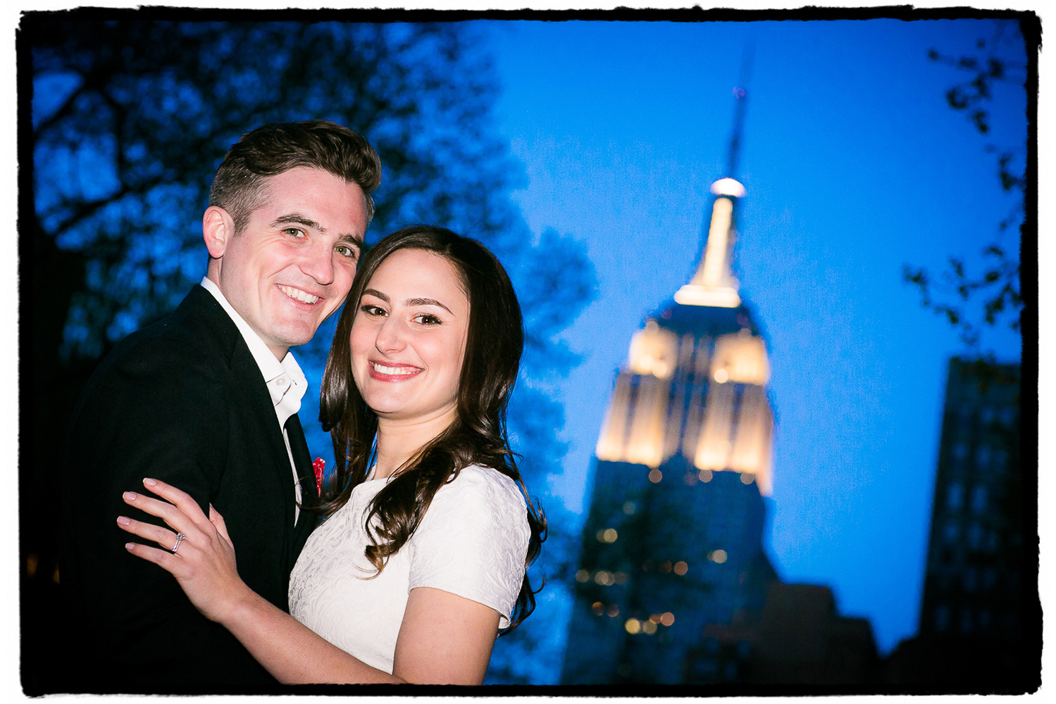 Engagement Portrait: Michelle & Dan pose for a picture in Madison Square Park, where they went on their first date at Shake Shack.