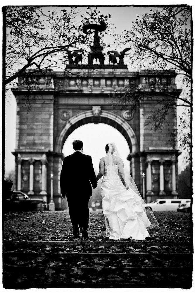 We stopped on the way from the church to the Prospect Park Picnic house for some pictures with the Arch at Grand Army Plaza.  They're shown here walking back to their limo.  I loved it in color with the fall leaves, but in black and white it looks so majestic, don't you think?